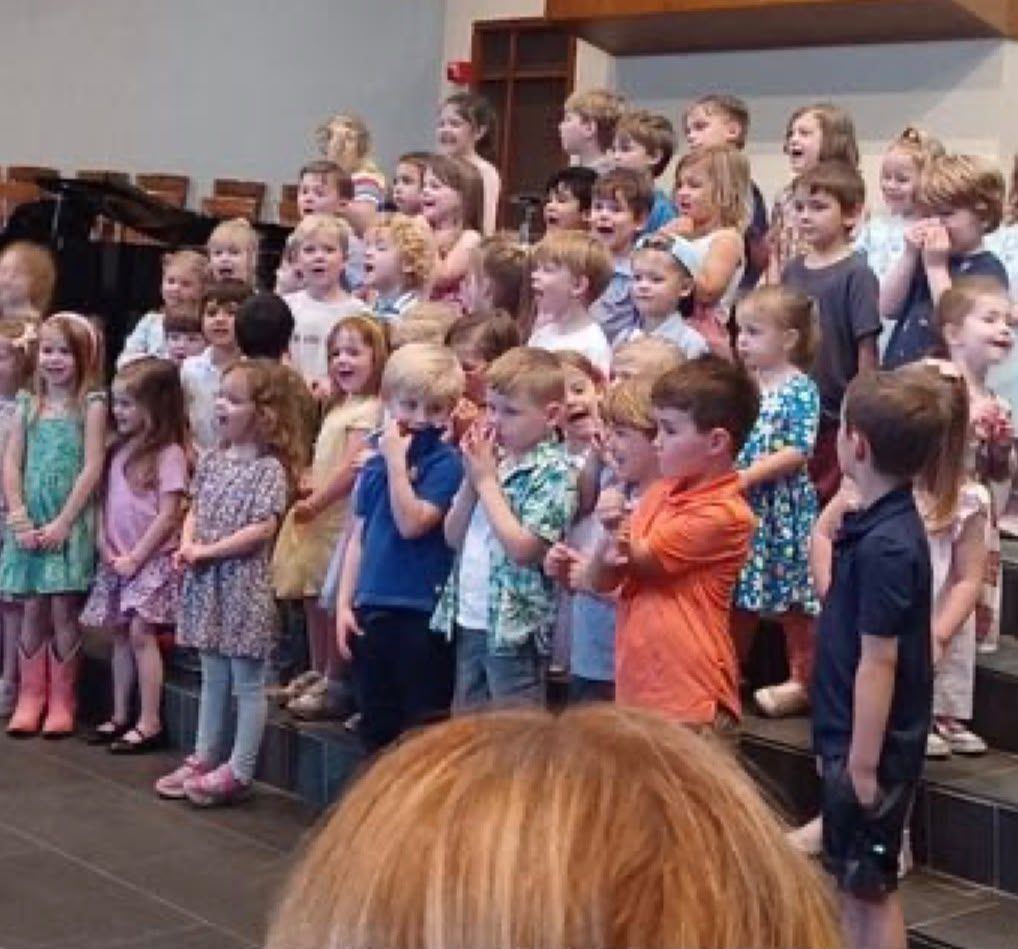 Children singing on stage